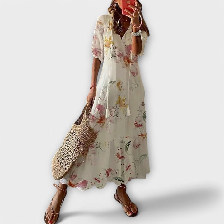 Elegant women's Savannah maxi dress with a beautiful printed design and flowy silhouette, perfect for summer.