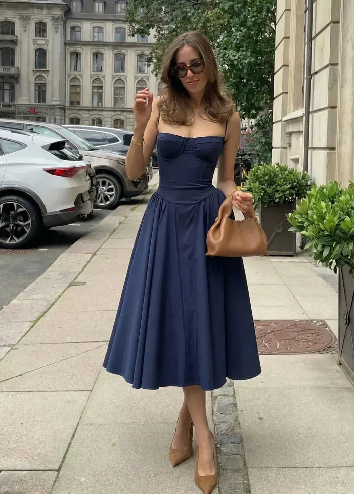 Chic blue women's sculpted corset dress. Fitted evening wear, perfect as a formal or cocktail dress for events.