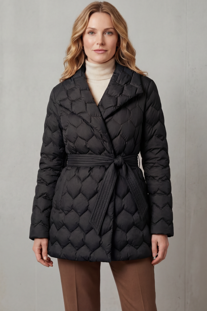 Women's quilted belted puffer jacket with sculpted fit. Stylish, warm outerwear for fall & winter fashion.