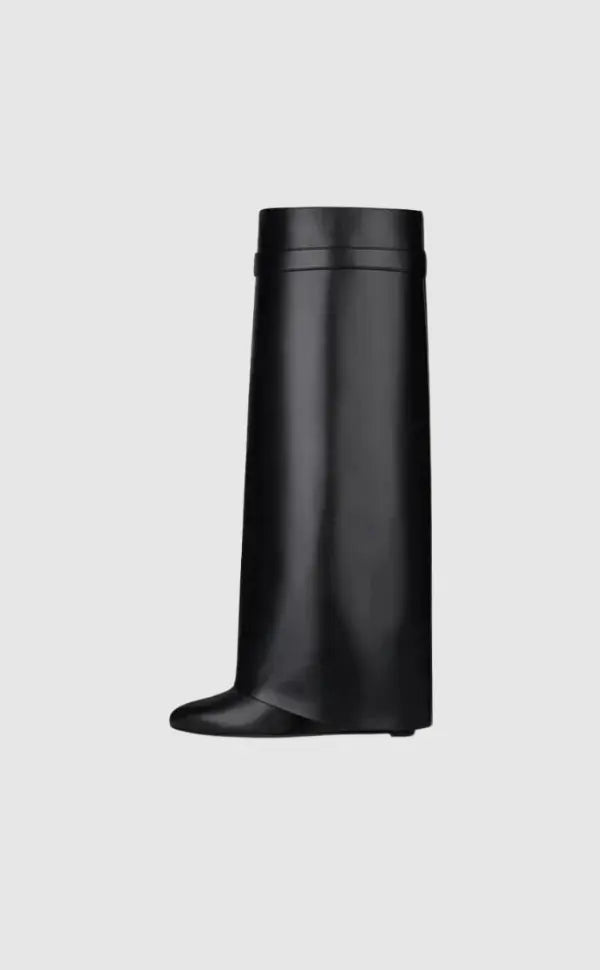 Women's sculptural glossy black wedge knee-high boots; modern fashion statement footwear.
