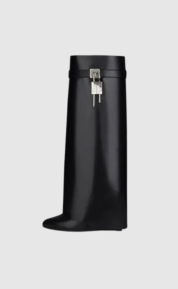 Elegant women's glossy knee-high boots with unique sculptural wedge heel.
