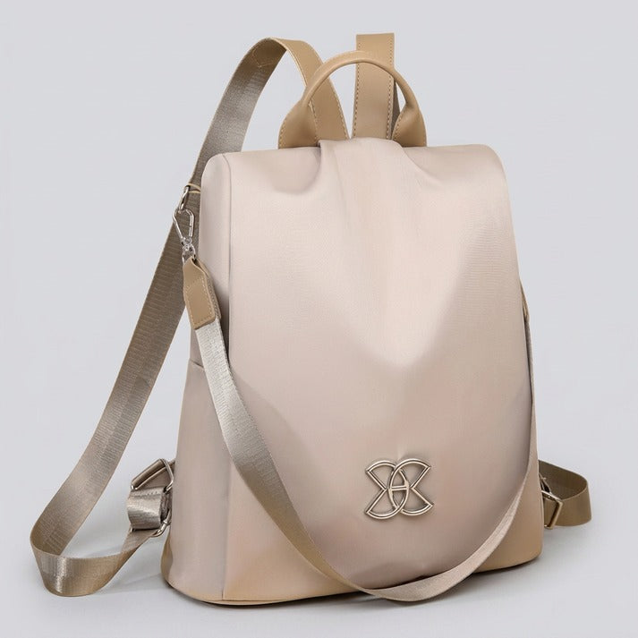 Close-up of the secure main compartment of a women's anti-theft shoulder bag, showcasing safety features.