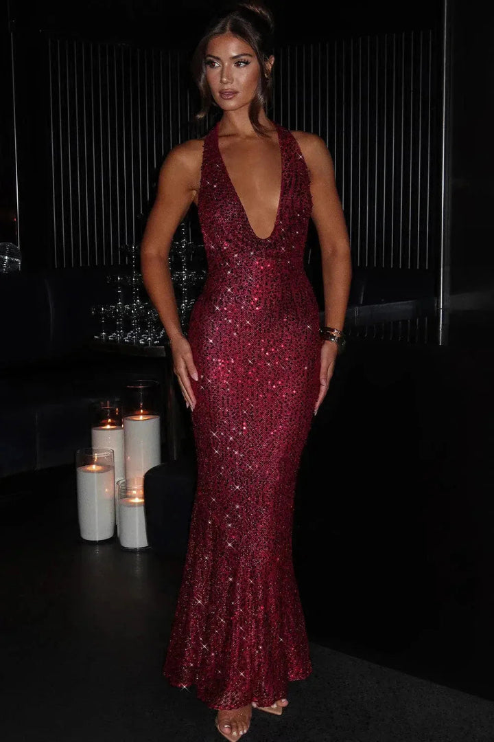Sophisticated women's sequin maxi dress, featuring a halter neck, open back, and full-length glamour.