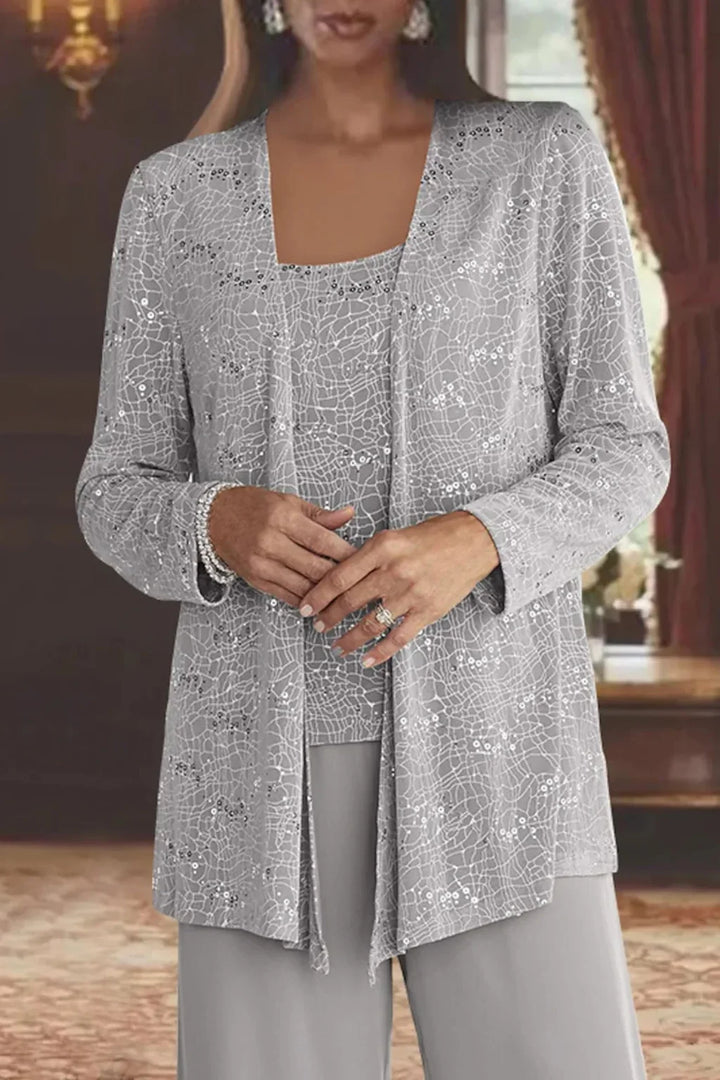 Glamorous women's sequin wide leg pants, part of a stunning three-piece set with matching jacket & top. Evening wear.