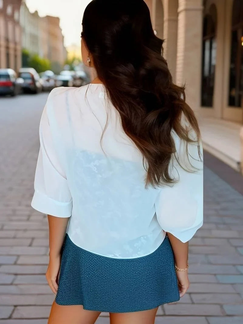 Versatile women's sheer top, 3/4 sleeve, tie front, elegant for spring fashion.