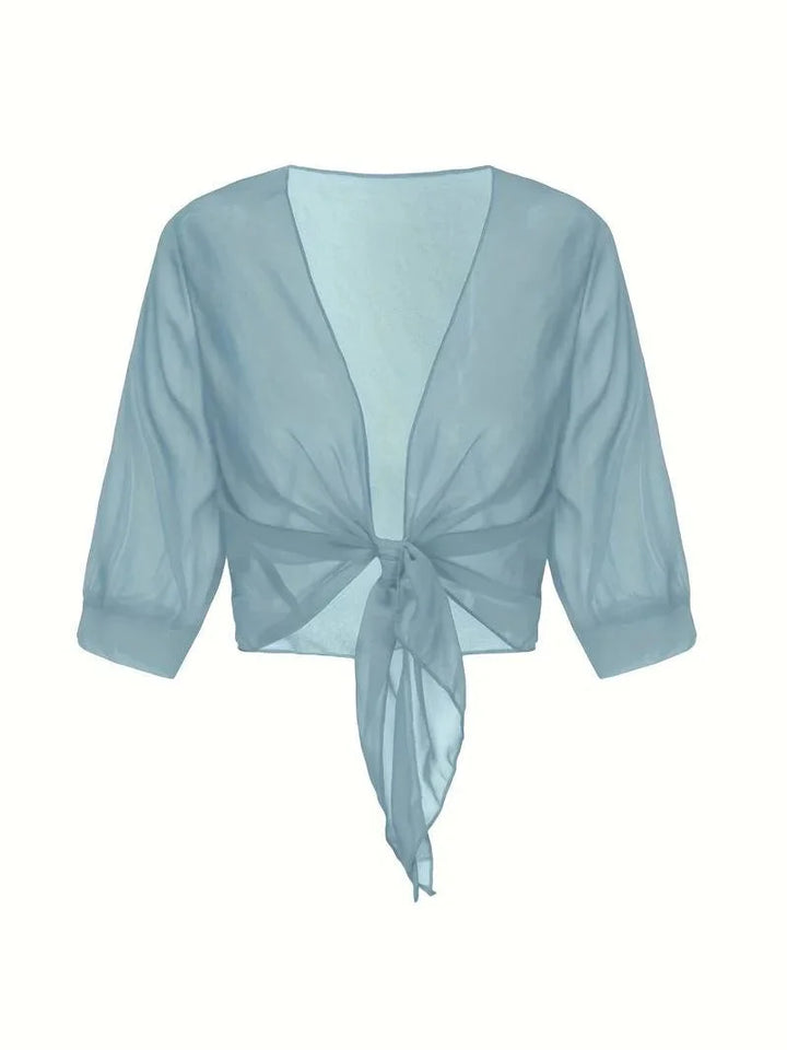 Comfortable women's sheer blouse, tie front, 3/4 sleeves, versatile for any occasion.