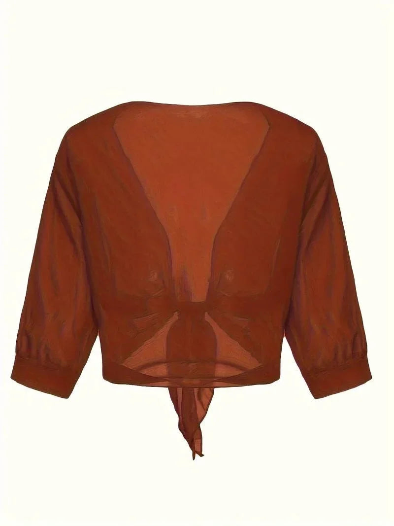 Fashionable women's sheer tie-front top, ideal for a stylish layering look.