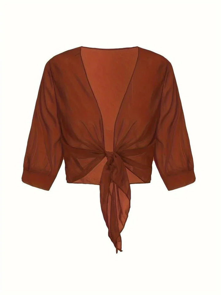 Effortless women's sheer blouse, 3/4 sleeves, tie front, perfect for warmer days.