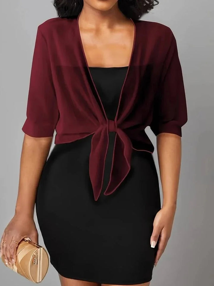 Versatile women's sheer tie-front blouse, comfortable for spring/summer wear.