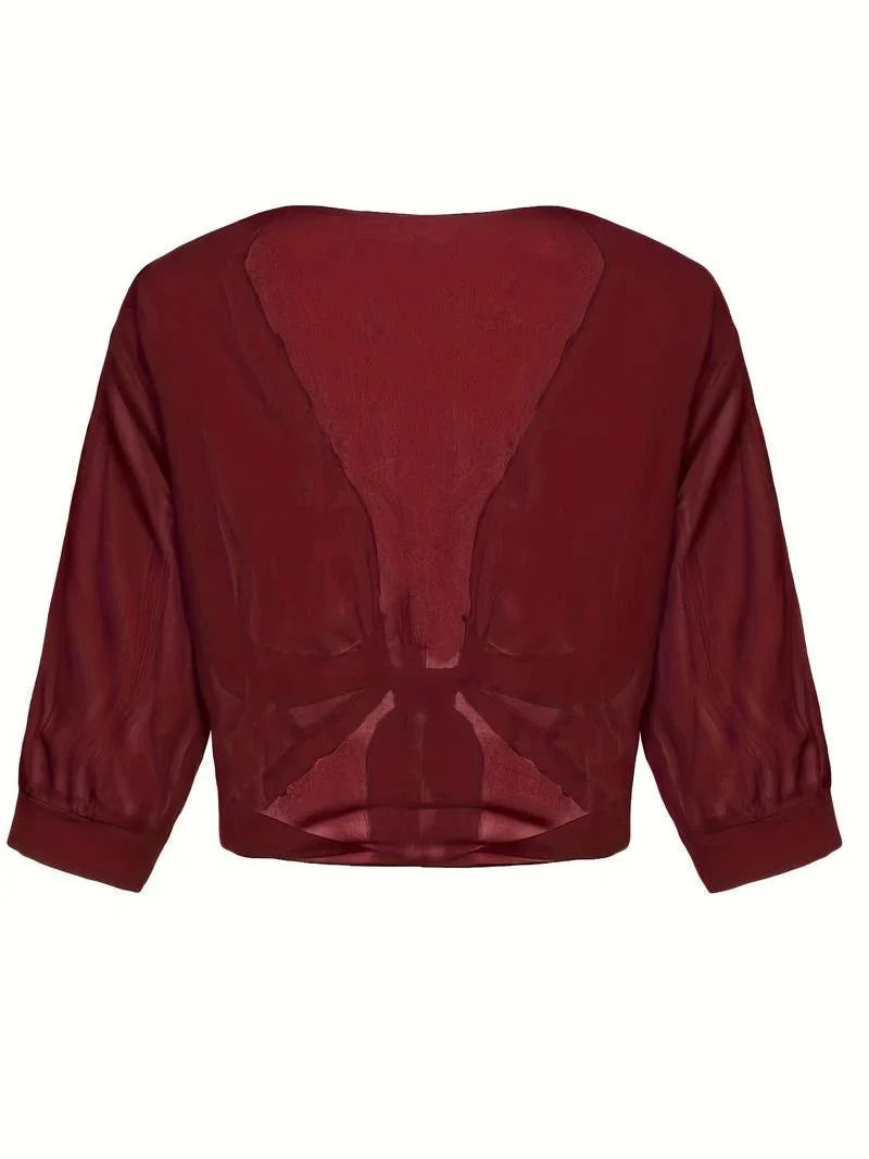 Chic women's sheer top with 3/4 sleeves and a flattering tie-front design.