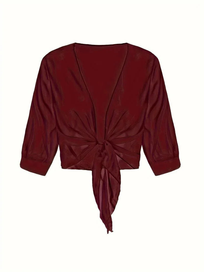 Lightweight women's sheer tie-front blouse, offering style and comfort for all day.