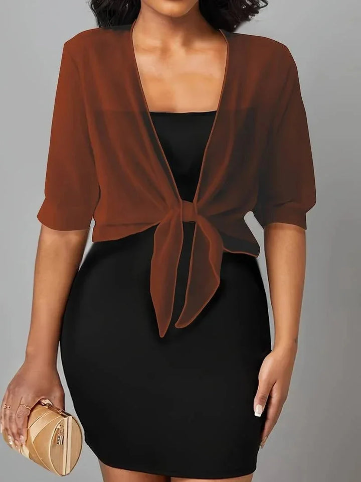 Stylish women's sheer blouse, open front, 3/4 sleeves, tie-front design for chic look.