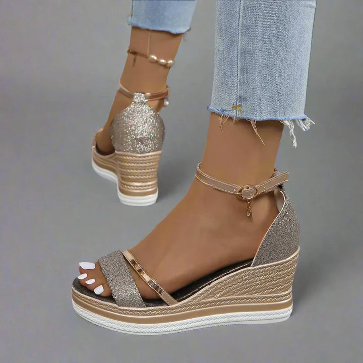 Women's shimmering glitter wedge platform sandals with an elegant ankle strap, perfect for parties and summer events.