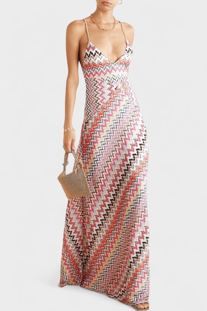 Women's shimmering metallic knit V-neck maxi dress, elegant and flowing, ideal for summer occasions & resort wear.