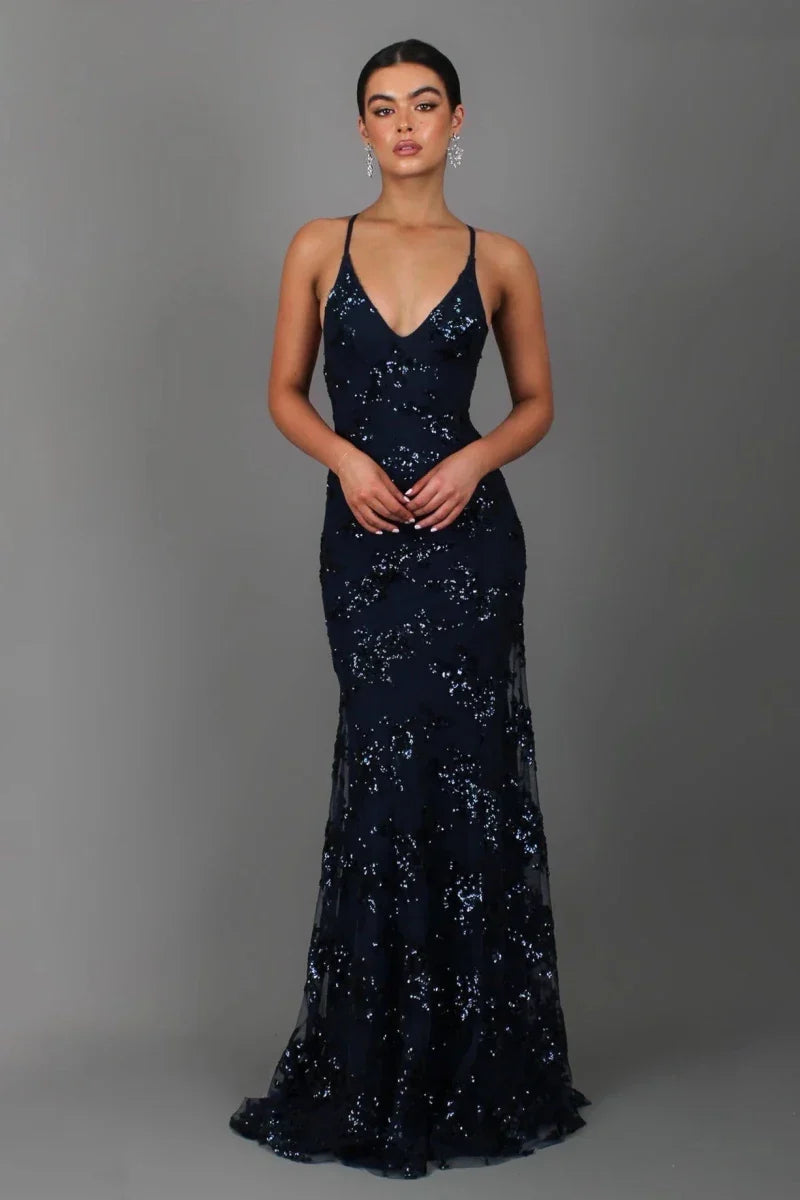 Elegant navy sequin floor length evening gown for women, featuring a V-neck and spaghetti straps. Ideal formal wear.