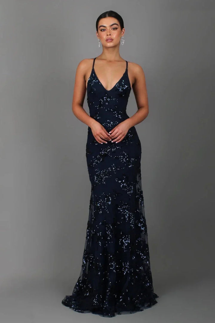 Elegant navy sequin floor length evening gown for women, featuring a V-neck and spaghetti straps. Ideal formal wear.