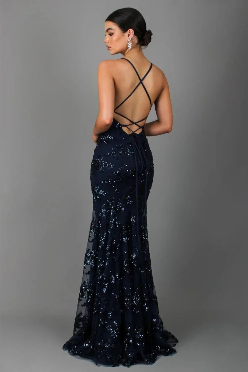 Chic grey sequin floor length evening gown with an open back, perfect for a gala or special occasion. Women's formal wear.