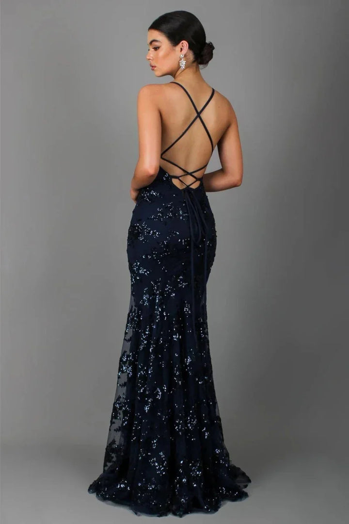 Chic grey sequin floor length evening gown with an open back, perfect for a gala or special occasion. Women's formal wear.