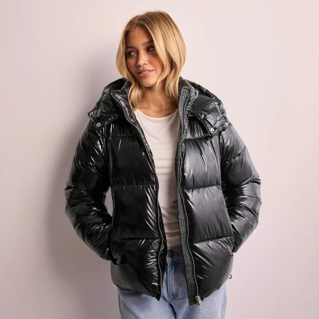 Women's shiny quilted jacket with removable hood, stylish winter fashion outerwear.