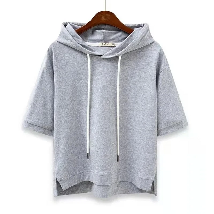 Women's short sleeve boxy fit hoodie in breathable cotton blend. Relaxed casual top with hood, everyday wear.