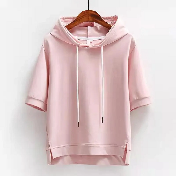 Stylish women's short sleeve boxy hoodie, ideal for spring/summer fashion. Breathable, relaxed fit casual top.