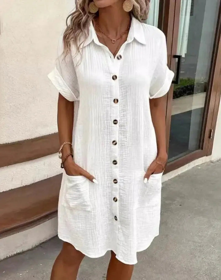 Women's short-sleeve button-down collared shirt dress. Effortless summer midi dress for casual everyday style.
