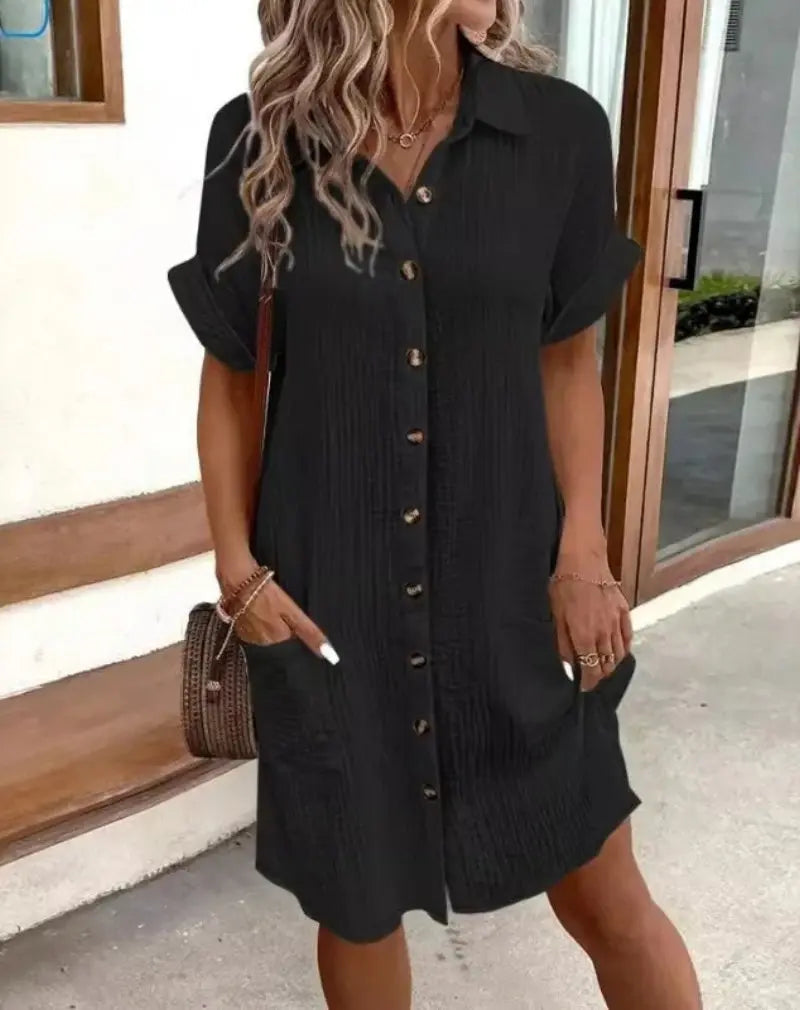Chic women's button-down shirt dress with collar & short sleeves. Perfect casual summer style or spring fashion.