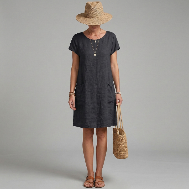 Chic women's casual short sleeve mini dress featuring practical pockets. Comfortable and stylish for summer days.
