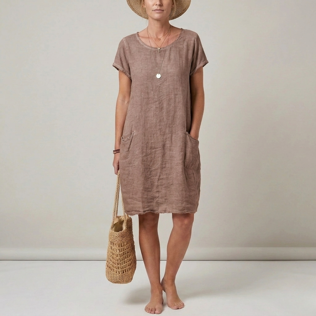Comfortable women's short sleeve casual mini dress. Versatile shift style with pockets, ideal for warm weather.