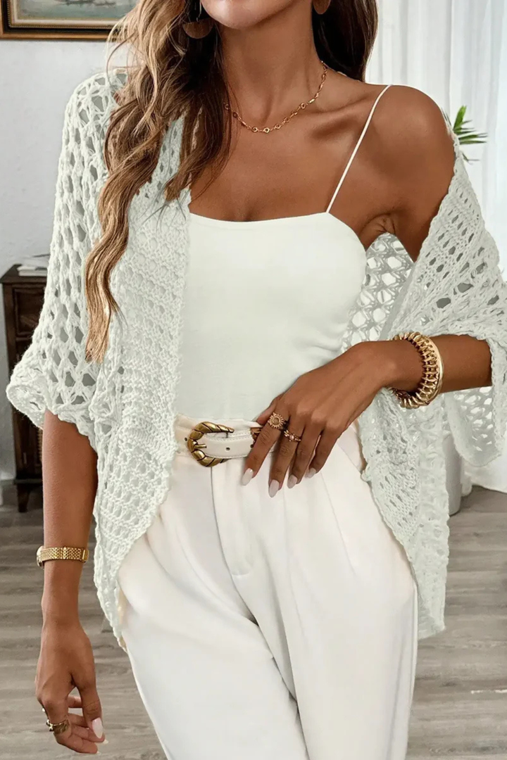 Lightweight women's short sleeve crochet cardigan, a textured knit layering piece for casual elegant spring outfits.