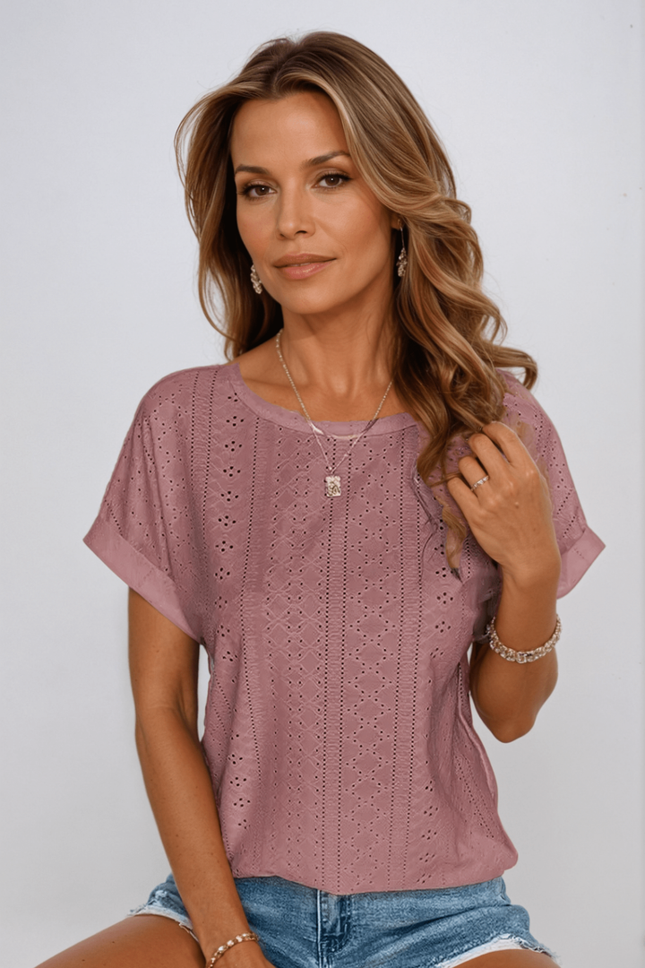 Stylish women's eyelet top. Short sleeve round neck blouse, great for casual summer wear or layering.