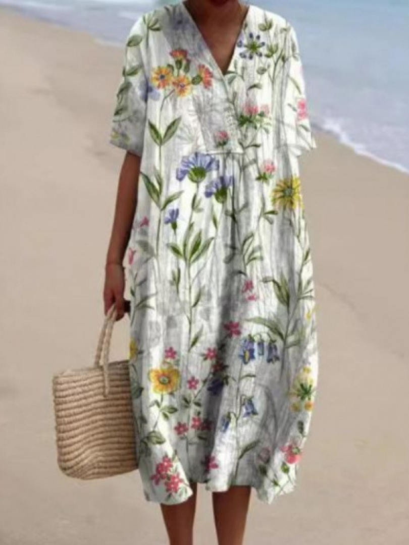 Elegant women's short sleeve floral midi dress, a comfortable pull-on style for relaxed spring fashion.