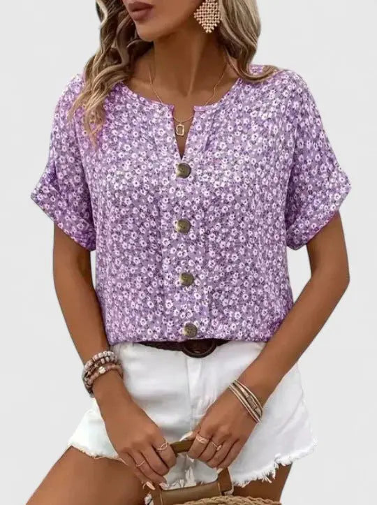 Cute floral print women's summer blouse with short sleeves and button front. Vintage-inspired, casual feminine top.