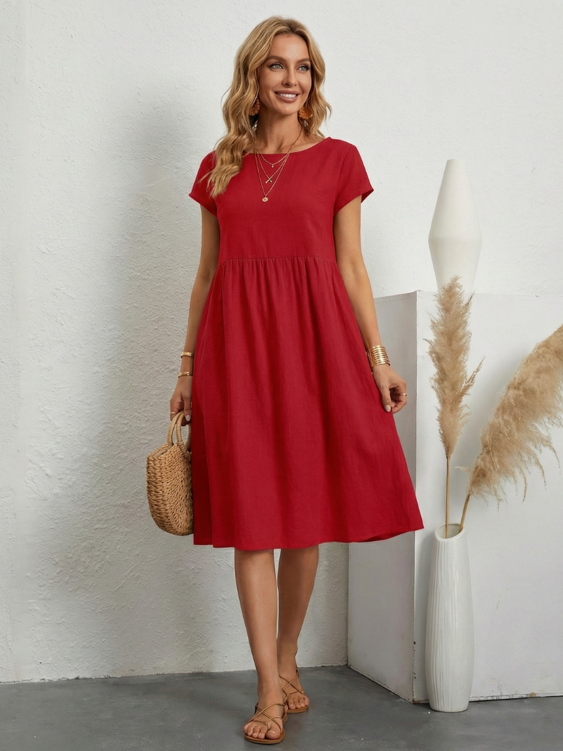 Soft, comfortable women's relaxed fit short sleeve knee-length dress with pockets. Perfect for summer days.
