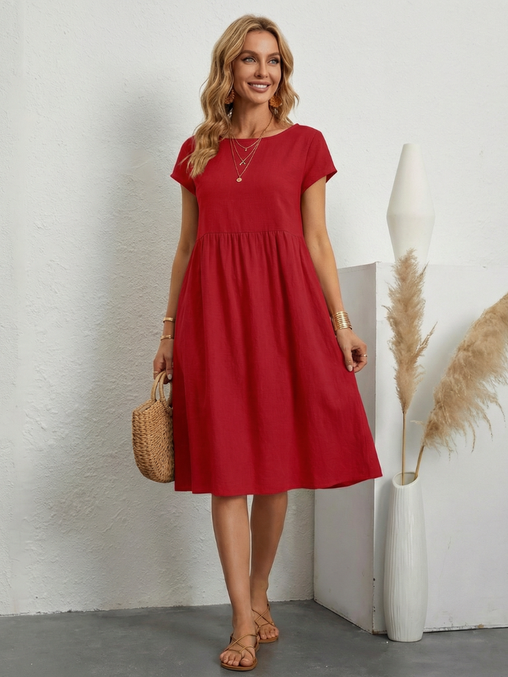 Soft, comfortable women's relaxed fit short sleeve knee-length dress with pockets. Perfect for summer days.