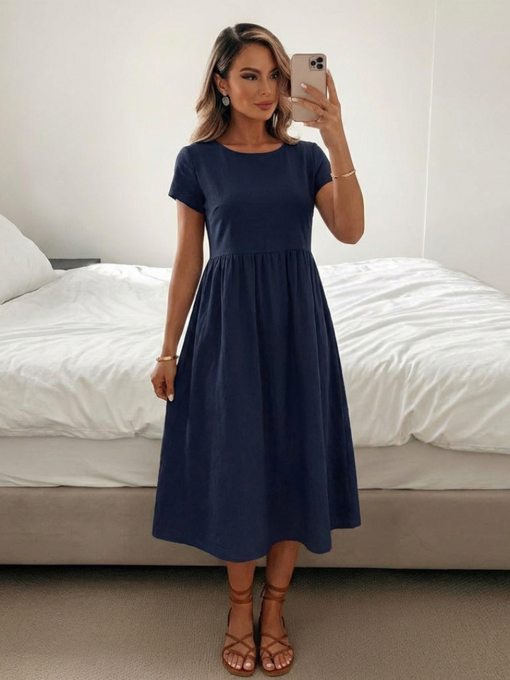 Comfortable women's short sleeve knee-length dress with pockets. Relaxed fit for effortless everyday style.