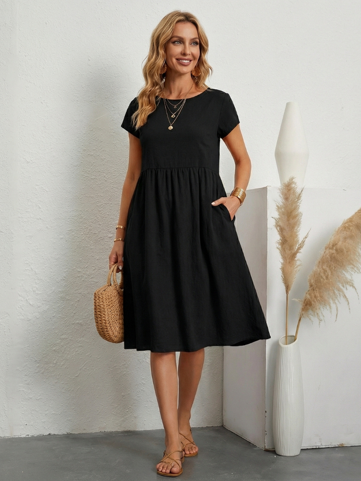 Women's casual short sleeve knee-length dress with pockets. Comfortable, relaxed fit for everyday spring/summer.