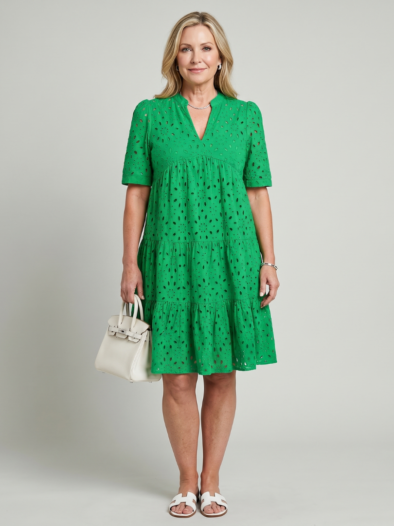 Women's short sleeve knee-length eyelet dress. Relaxed fit summer daywear for casual occasions.