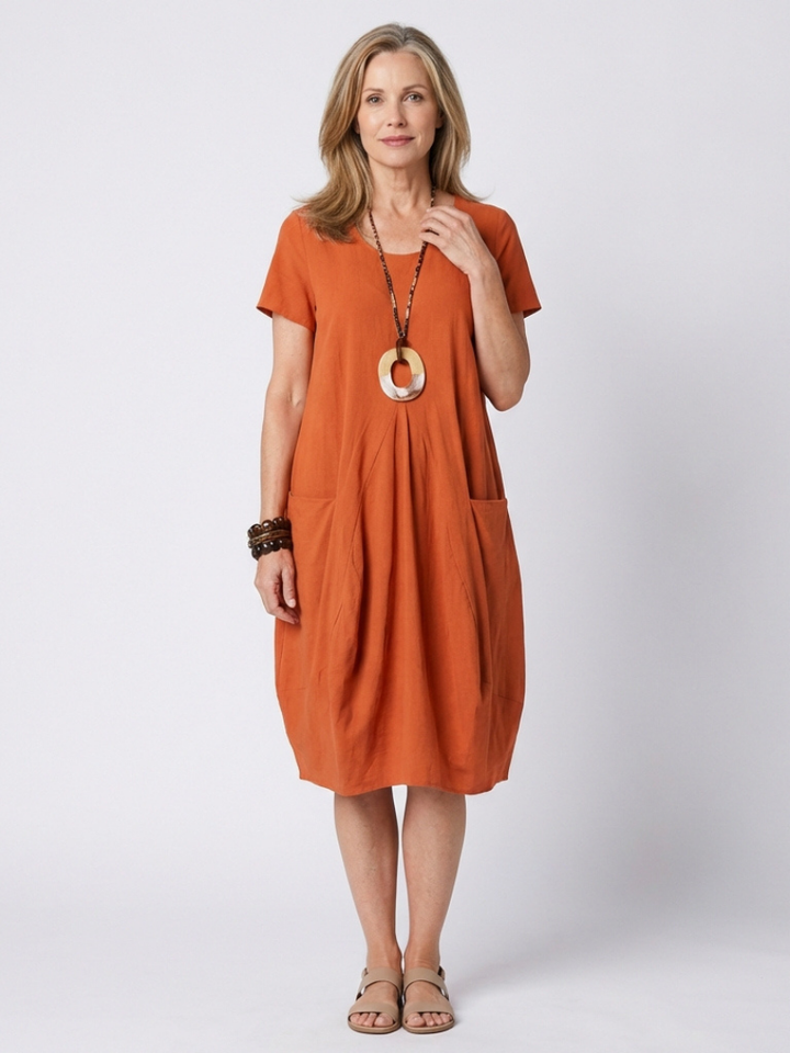 Women's short sleeve pleated knee-length casual dress for everyday comfort.