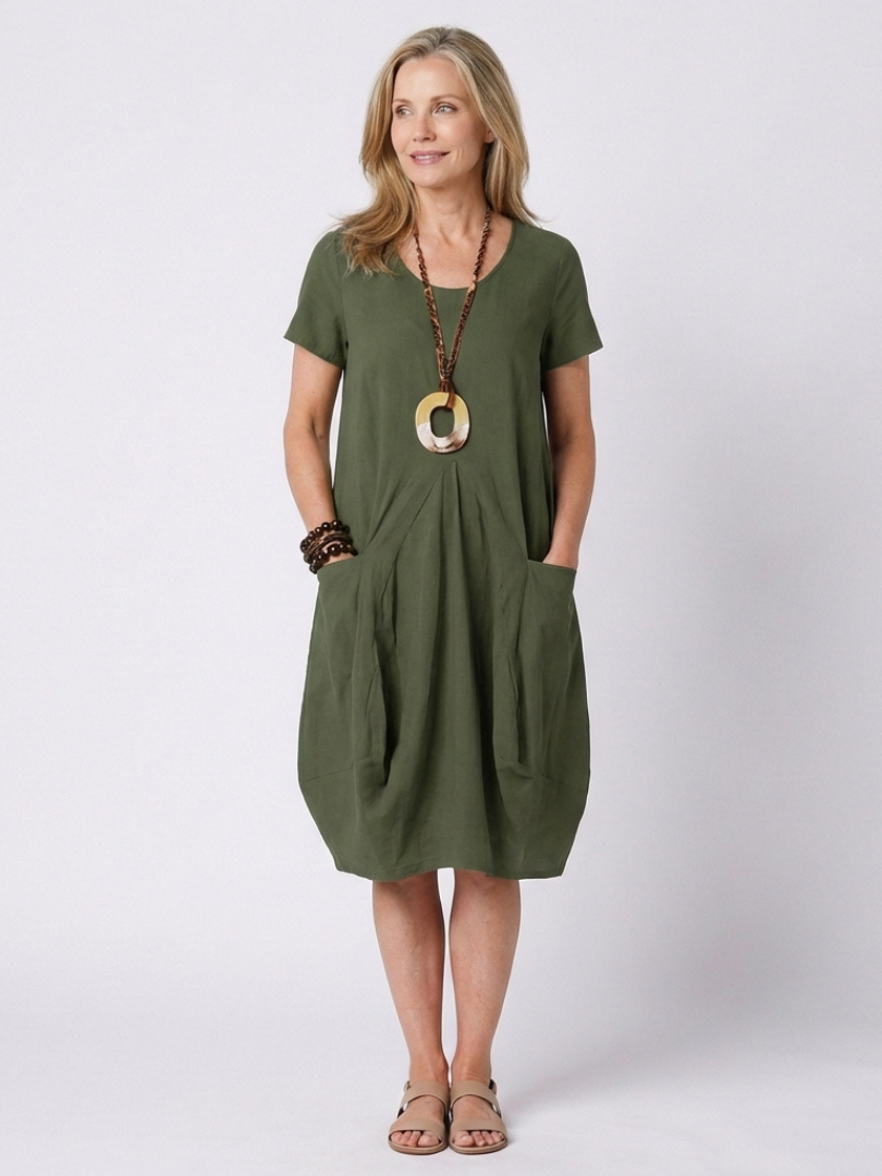Women's short sleeve pleated dress, knee-length design, perfect for comfortable everyday wear.