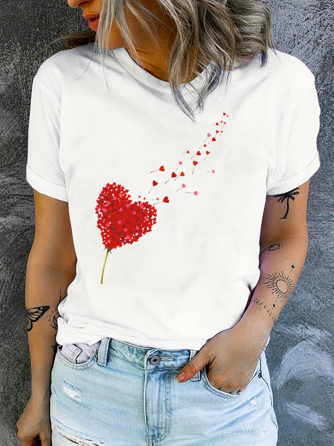 Romantic women's graphic tee with heart & floral print. Stylish round neck, short sleeve top for everyday casual wear.