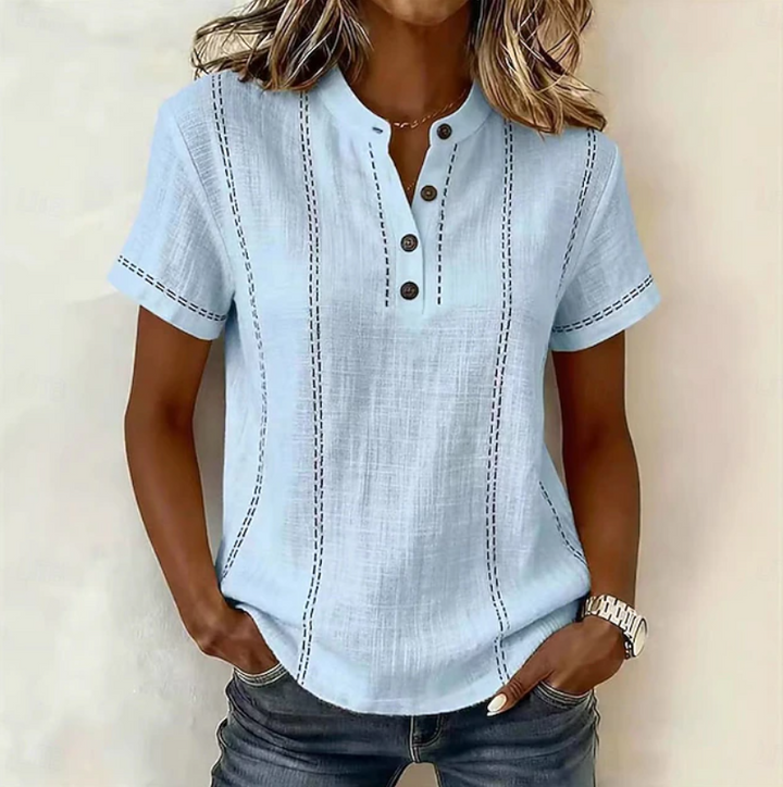 Comfortable women's textured short sleeve top with buttons. Relaxed fit casual shirt, ideal for daily wear.