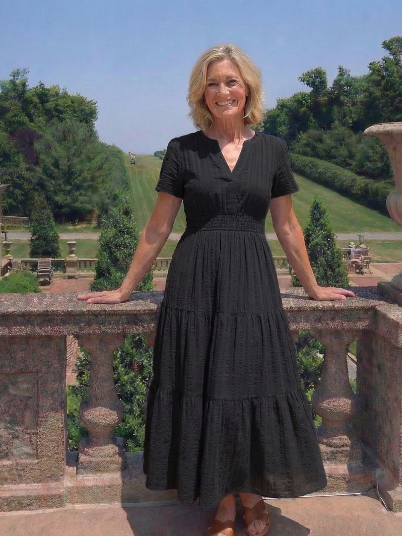 Apricot short sleeve tiered maxi dress for women, with a smocked waist, ideal for comfortable summer fashion.