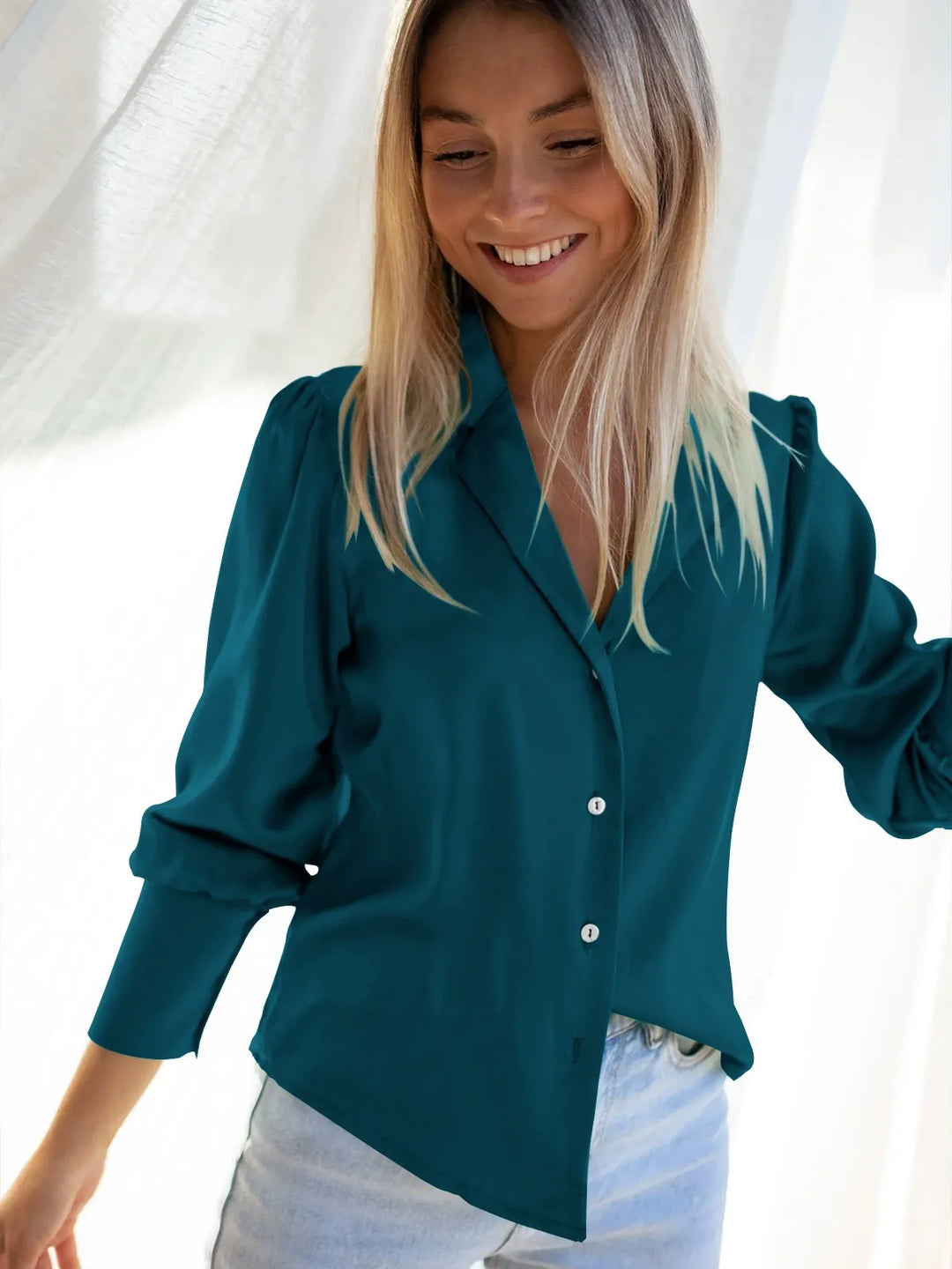 Elegant silky blouse for women, featuring a relaxed fit and button-down front, versatile for any occasion.