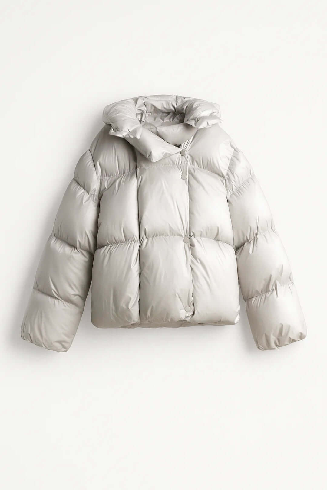 Women's silver grey puffer jacket, modern & voluminous. Warm winter coat with oversized collar for cold weather style.