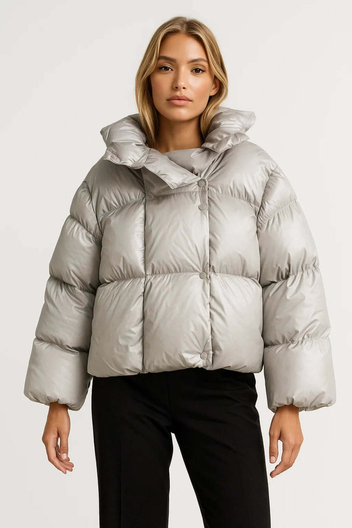 Trendy women's olive green puffer jacket with snap buttons. Stylish & warm outerwear for casual cold weather fashion.