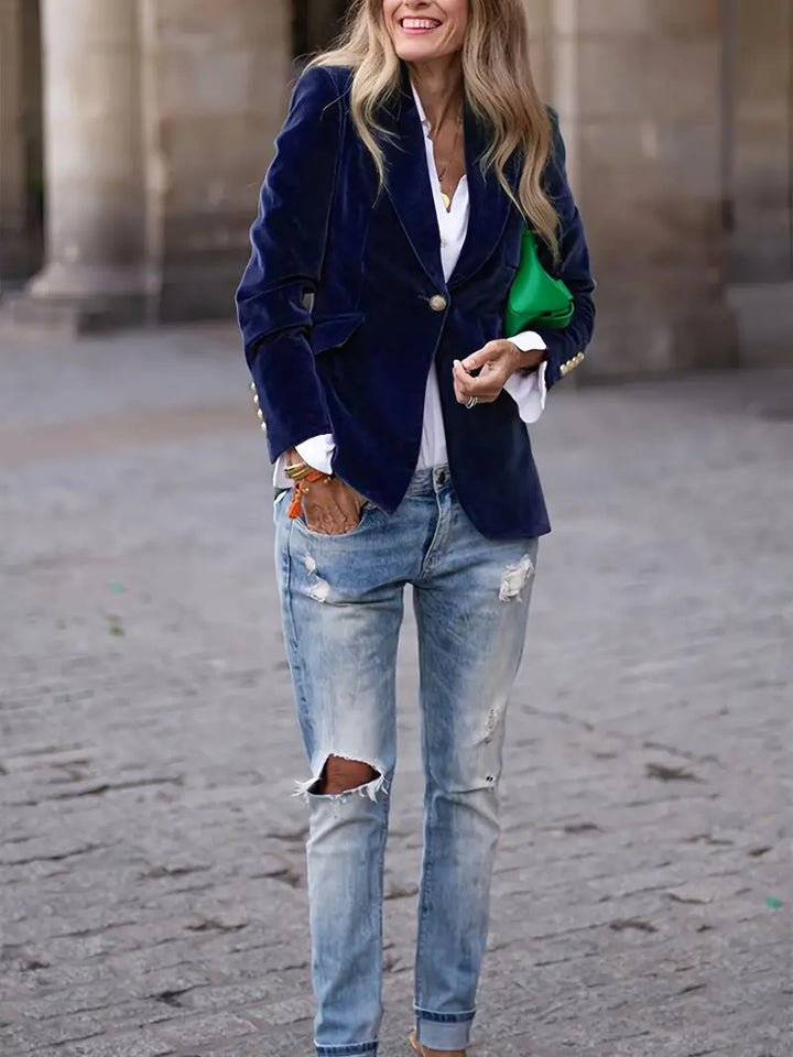 Modern women's tailored jacket, single button, for an elegant office ensemble.