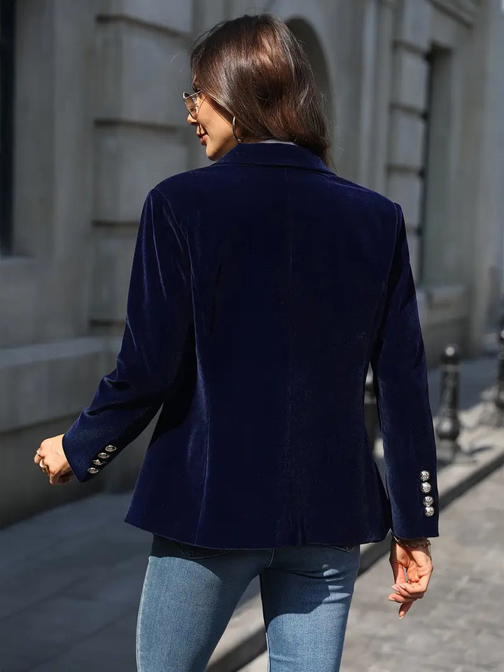 Chic women's professional blazer with a single button, suitable for corporate meetings.