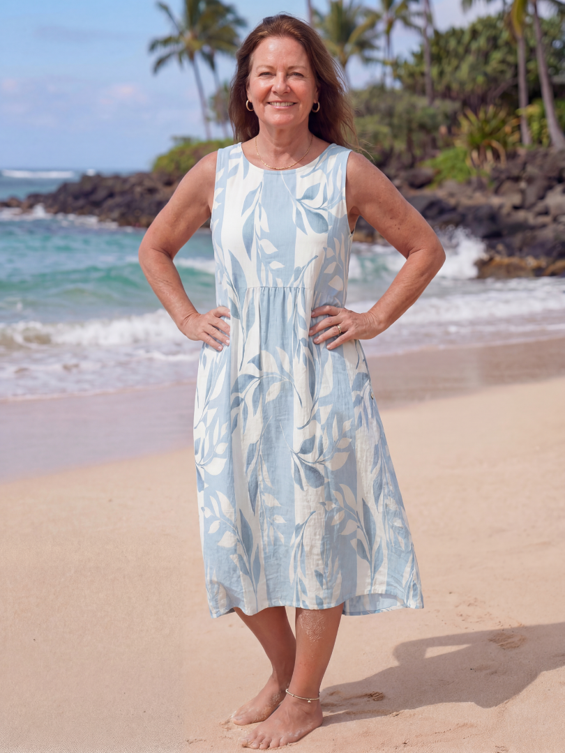 Women's sky blue botanical print midi dress, sleeveless, flowy, and comfortable for elegant summer casual wear.