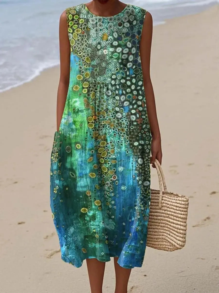Women's sleeveless abstract print relaxed midi dress with pockets, ideal for summer, beach, or casual wear.